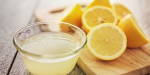 Lemons and lemon juice on a table
