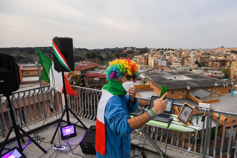 someone playing music on a rooftop