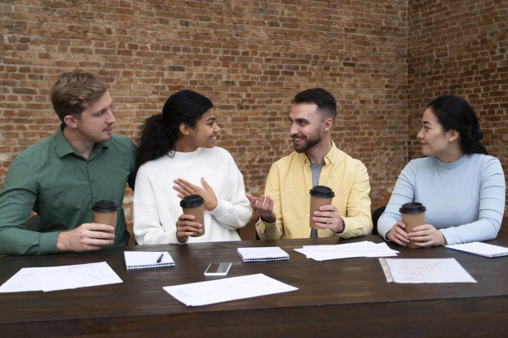 Team smiling during a meeting while experiencing easy to work with burnout