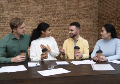Team smiling during a meeting while experiencing easy to work with burnout