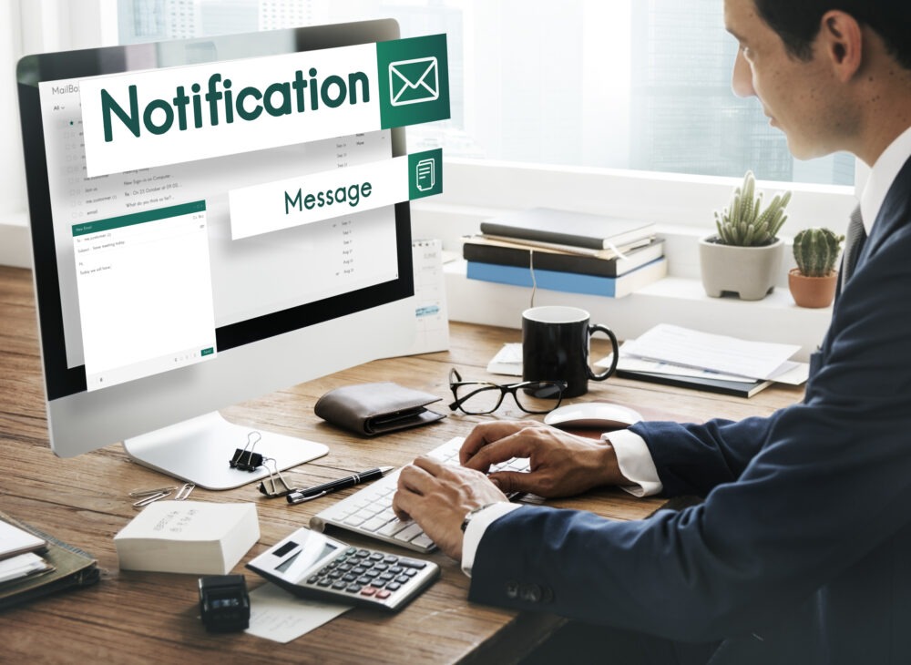man receiving chat notification symbolizing email vs chat shift at work