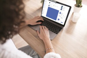 A woman typing on her laptop showing the LinkedIn personality in MENA.