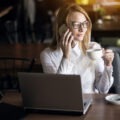 Confident woman sitting at desk with calm expression