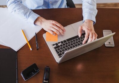 Professional focusing on tasks at a laptop in a calm office