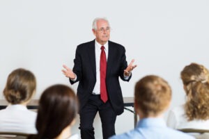 Business leader speaking openly with employees in a collaborative workspace