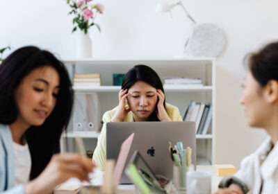 Employee sitting at desk experiencing burnout at work